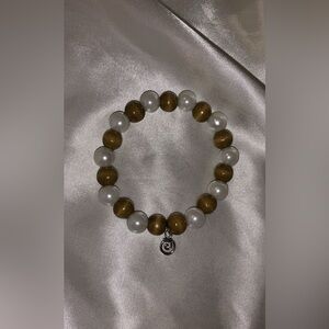 Hand crafted bohemian beaded white pearl bracelet with silver charm